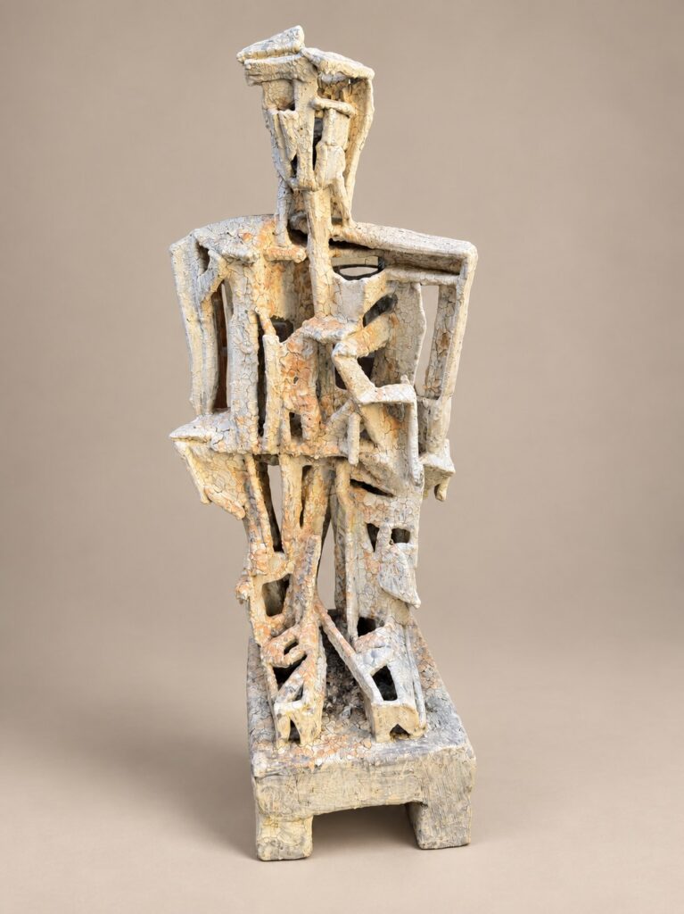Cream cubist seated figure. Ceramic sculpture by Ted Fullwood